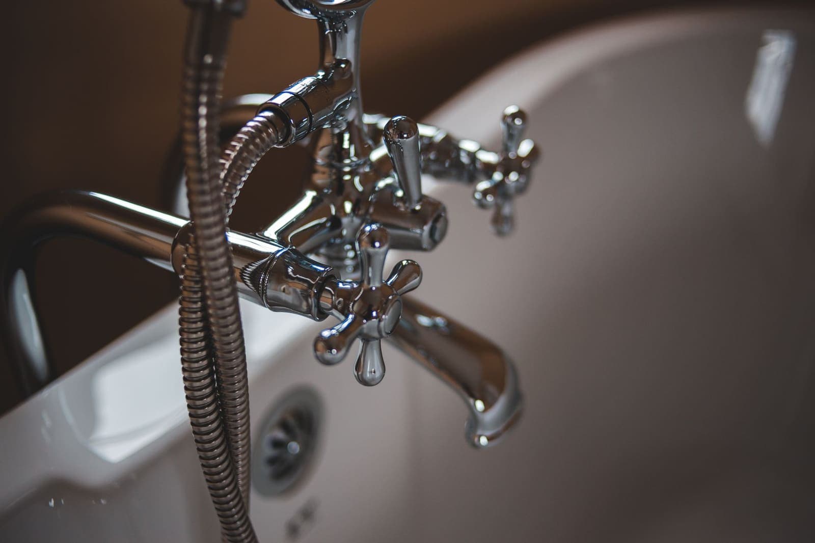 Close-up of a chrome faucet in a modern bathroom, typical of Addison's higher-density housing.